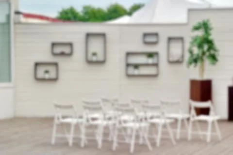 Blurred background image of the interior with white chairs for the wedding ce Stock Photos
