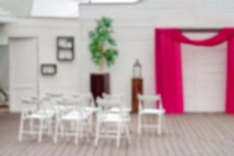 Blurred background image of the interior with white chairs for the wedding ce Stock Photos