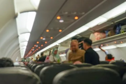 Blurred background of interior aircraft , luggage cabin. the atmosphere in .. Stock Photos