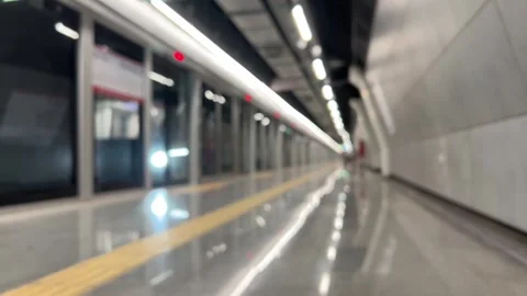 Blurred background with interior of a metro or subway station with arriving trai Stock Footage 259650804