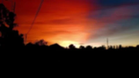 Blurred background. The light of the setting sun penetrates the sky. The com Stock Footage 295931717