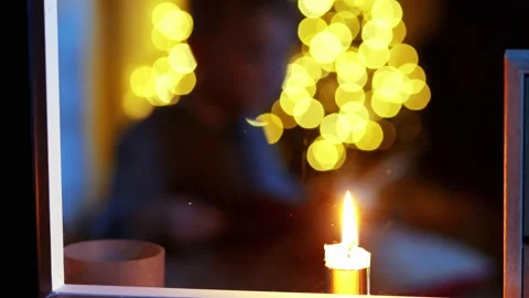 Blurred background of little boy write letter to Santa near christmas tree in Stock Footage 141918563
