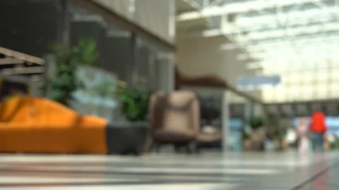 Blurred background: Main aisle of a branded clothing store Stock Footage 312313994