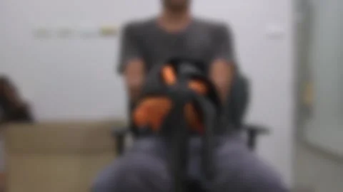 Blurred background man sitting on office chair open umbrella indoor. Stock Footage 251512108