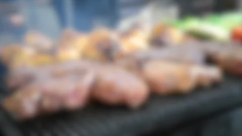 Blurred background. man turns meat steaks and chicken legs on the grill close up Stock Footage 137669707