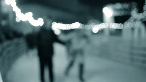 Blurred background. Many people skating on open-air ice skating rink Stock Footage 224104882