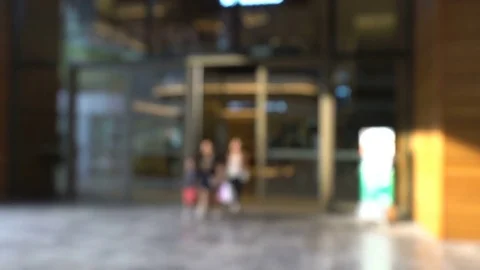 Blurred background with many people walking into the supermarket scene Stock Footage 81429867
