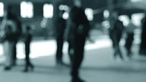 Blurred background. Many people walking inside a large room with windows day Stock Footage 296425871