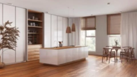 Blurred background, minimalist japandi kitchen. Island and dining table wit.. Illustrazione stock