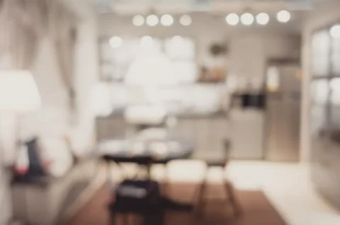 Blurred background modern kitchen and dinning room in house with bokeh light. Foto stock