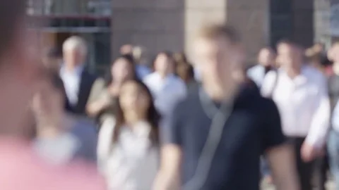 Blurred background of morning commuters on their way to work, in slow motion - g Stock Footage 77635458