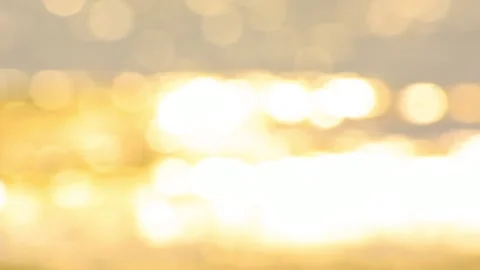 Blurred background motion with gold glitter bokeh and sunlight effect. Blurry ba Video stock 133885145