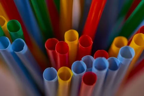Blurred Background Multicolored Plastic Drinks Tubes. Close-up. Stock Photos