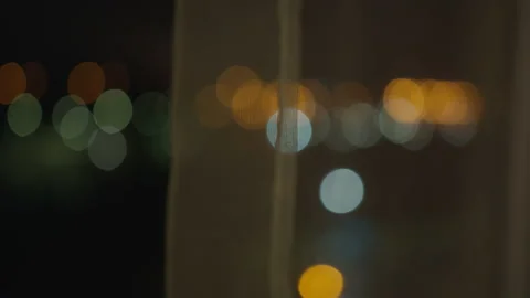 Blurred background from a night window covered with tulle Stock Footage 153948310