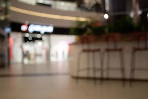 Blurred background or defocused image of cafe or coffee shop in mall for use as Stock Photos