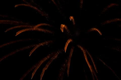 Blurred background of orange fire stripes on a black background. Stock Photos