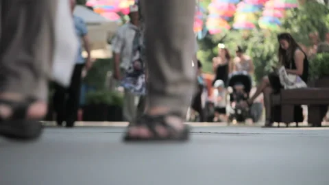 Blurred background. People walking under the Decorated Colored Umbrellas Stock Footage 111257178