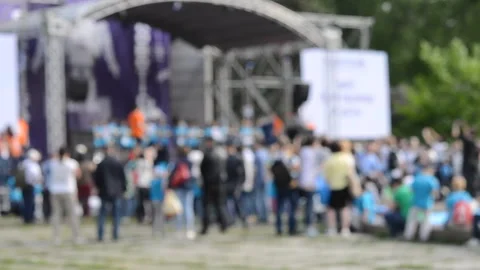 Blurred background. Performance on stage. Crowd of people standing near stage Stock Footage 303038108