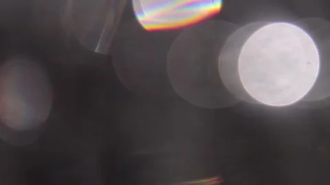 Blurred background of prismatic crystal lights in black Видео 318591063