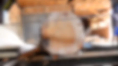 Blurred background. Process of machining logs in equipment sawmill machine saw Stock Footage 138005497