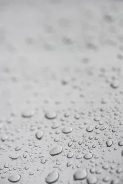 Blurred background with rain drops on window pane Stock Photos