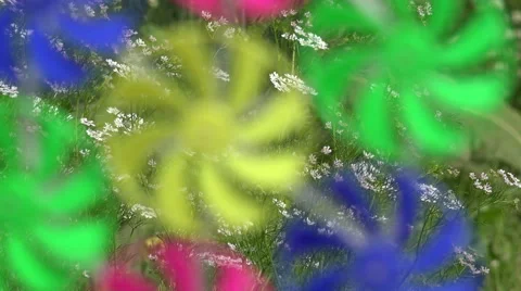 Blurred background of rainbow windmills turning, 4K Stock Footage 64760453