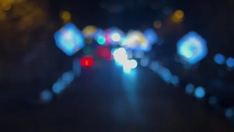 Blurred background. Red and white lights bokeh. Cars flow out of focus on road Stock Footage 347562640