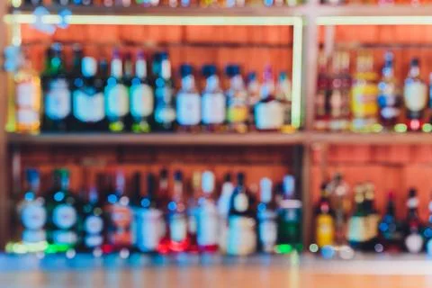 Blurred background with restaurant blur interior. alcohol alcohol bottles. Stock Photos