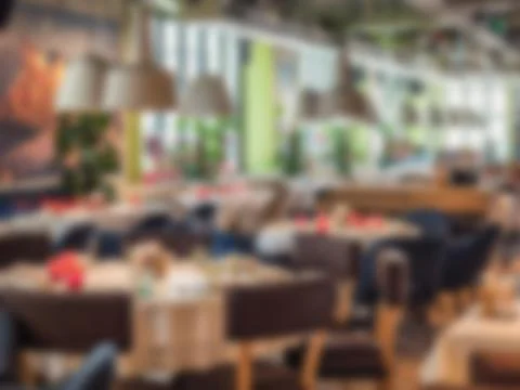 Blurred background of restaurant with tables Фото