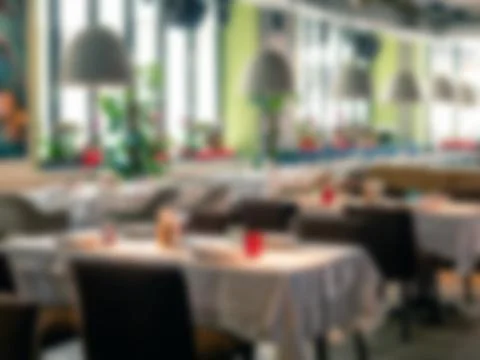 Blurred background of restaurant with tables Фото