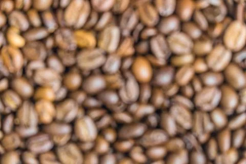 Blurred background of roasted coffee beans texture Stock Photos