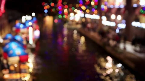 Blurred background of San Antonio river walk at night with Christmas lights Video stock 249553090