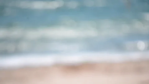 Blurred background sea beach sand waves seacoast sunny summer day Abstract view Stock Footage 245472803
