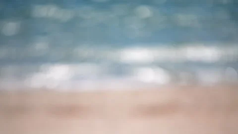 Blurred background sea beach sand waves seacoast sunny summer day Abstract view Stock Footage 246995703