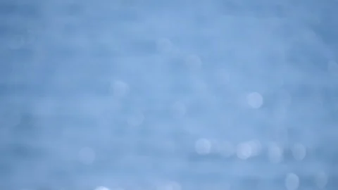 Blurred background. Sea, white sun reflections and blue waves 库存影片 200976340