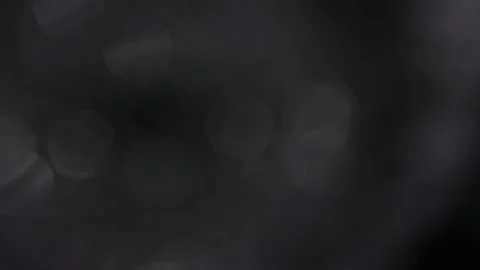 Blurred background in a seamless loop of white bokeh Stockbeeldmateriaal 317480903