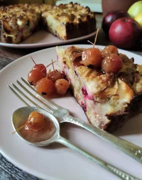 Blurred background. A slice of Apple pie and a jam of Paradise apples with a Stock Photos