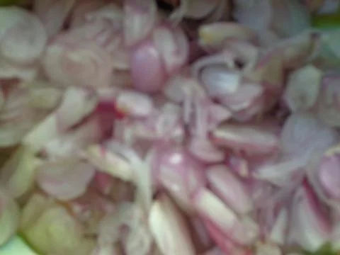 A blurred background of sliced shallots cut into small pieces Stock Photos