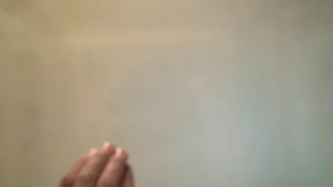 On blurred background in slow motion pills falling on glass table Video stock 128840949
