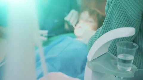 Blurred background a small child boy in a dentist's chair Stock Footage 259007054