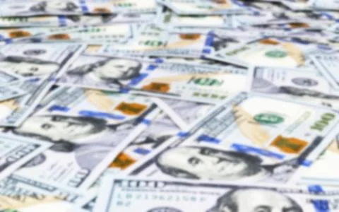 Blurred background with Stack of one hundred dollar bills. Blur Stack of ca.. Stock Photos