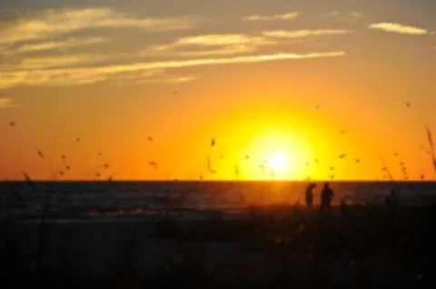 Blurred Background a Sunset on the Beach Stock Photos