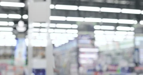 Blurred background of a supermarket or retail store interior with bright lights Stock Footage 330384308