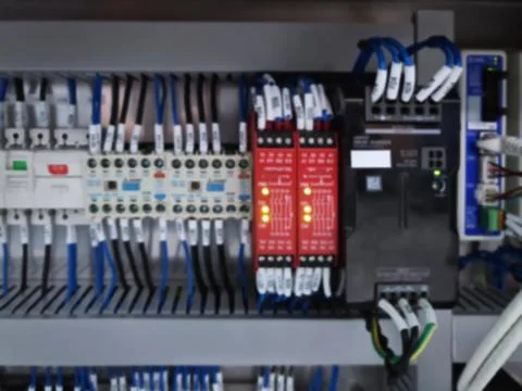 Blurred Background of Switches and Wiring Inside of Electrical Cabinet Stock Photos