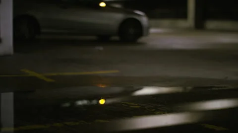 Blurred background of thief running away as car alarm goes off Stock Footage