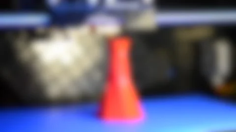 Blurred background. Timelapse 3D printer printing isolated volume triangular Stock Footage 137672986