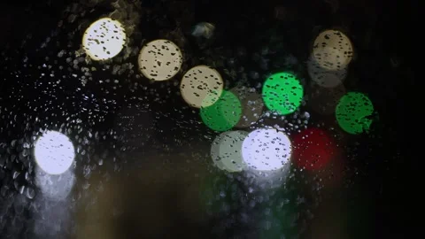 Blurred background of traffic light and moving cars with street lights. Video stock 265013382
