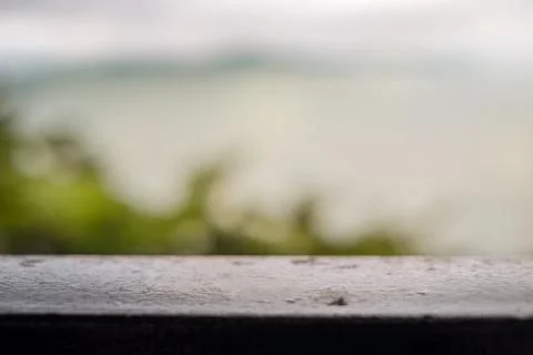 Blurred background tree and sea. metal railing Stock Photos