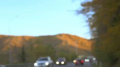 Blurred background. The view from the car on a hilly road, along magnificent Stock Footage 119697022