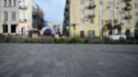 Blurred background view of the road and the sidewalk where cars drive Stock Footage 109495167